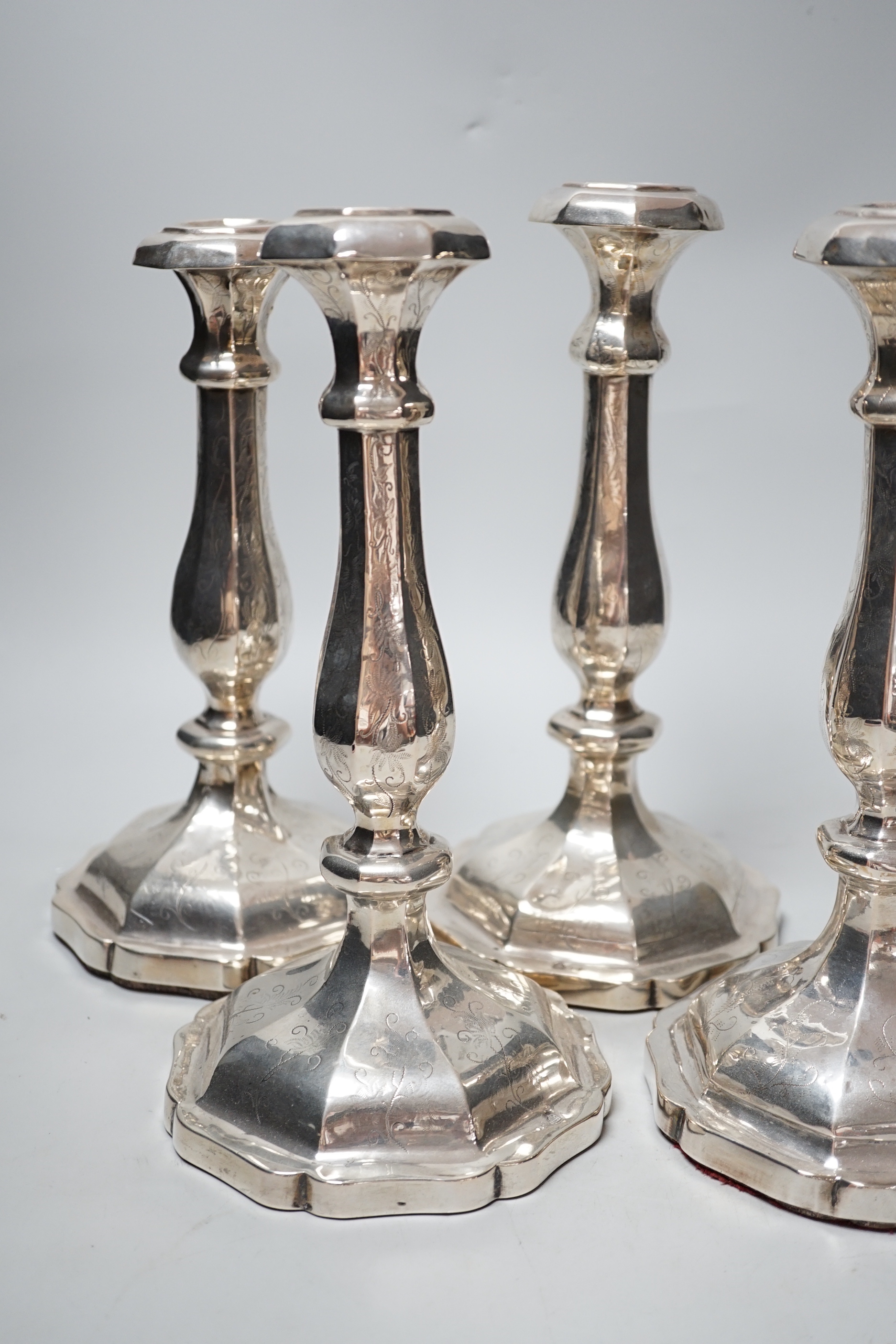 A set of four 19th century Austro-Hungarian white metal candlesticks, dated 1863, height 27.4cm, et infra (a.f.), weighted.